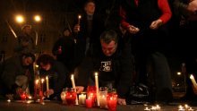 Civic Action activists light candles outside HDZ election HQ