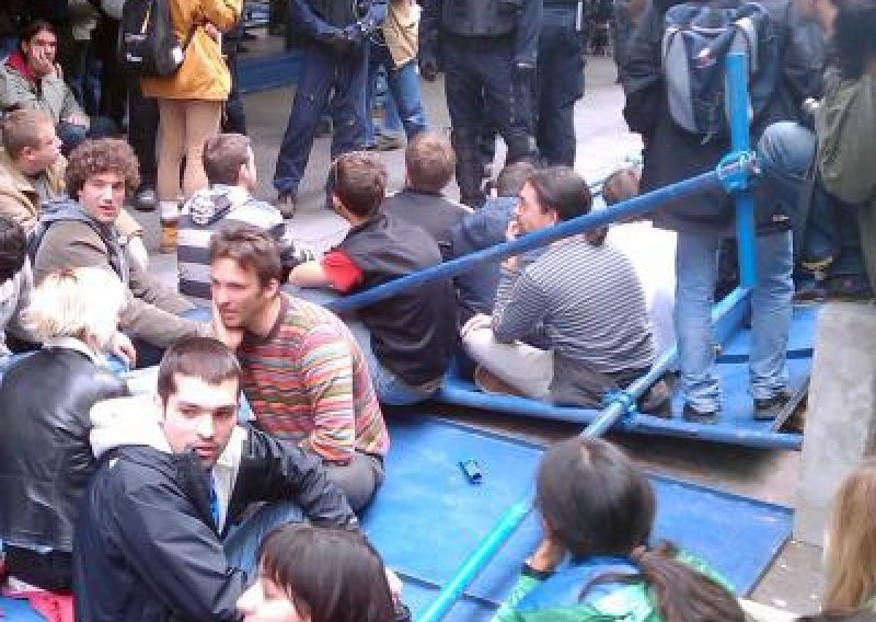 Protesting activists tear down construction fence in Varsavska Street