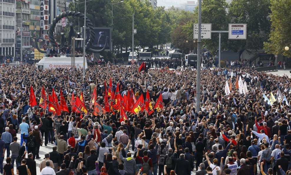 People gather in a square during a commemoration for the victims of Saturday's bomb blasts in the Turkish capital, in Ankara, Turkey, October 11, 2015. Turkish investigators worked on Sunday to identify the perpetrators and victims of Saturday's bomb blas