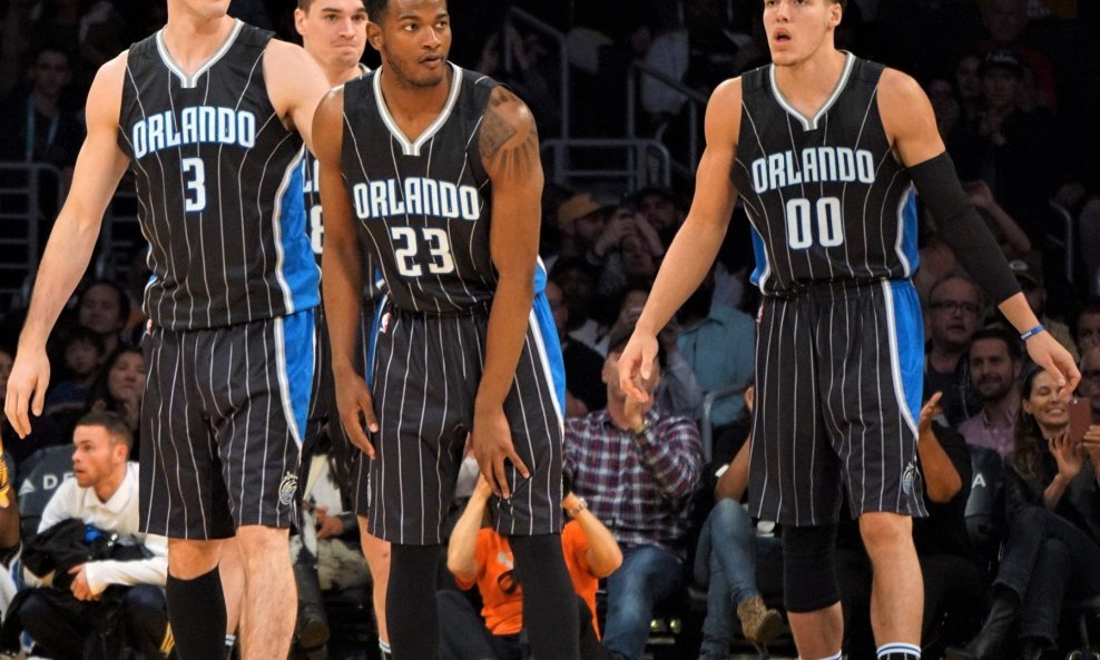 Damjan Rudež (3), CJ Wilcox (23) ve Aaron Gordon (00)